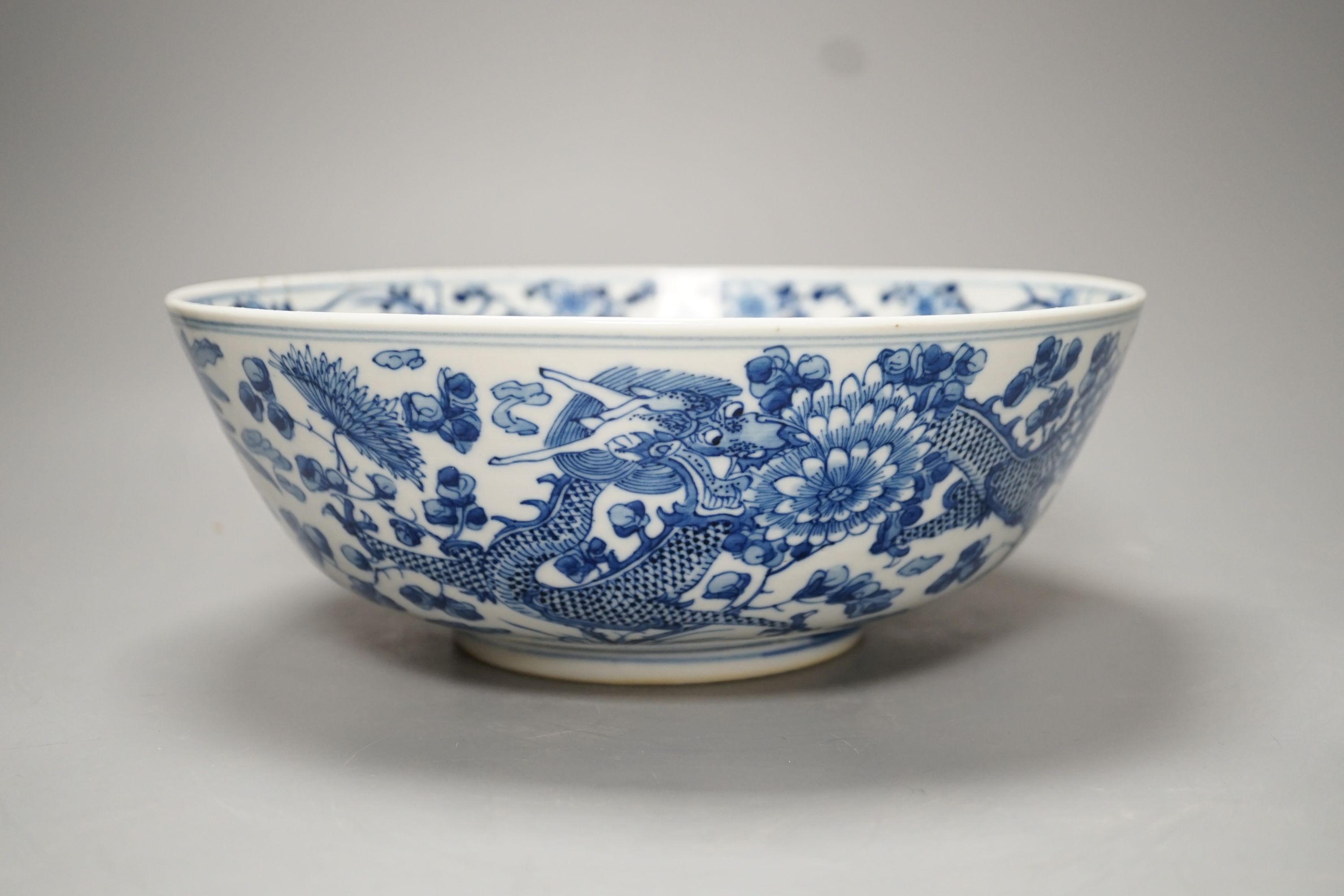 A 19th-century Chinese blue and white ‘dragon’ bowl - 27cm diameter